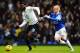 LONDON, ENGLAND - FEBRUARY 09: Emmanuel Adebayor (L) of Tottenham Hotspur holds off the challenge of Steven Naismith (R) of Everton during the Barclays Premier League match between Tottenham Hotspur and Everton at White Hart Lane on February 9, 2014 in L
