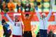 SOCHI, RUSSIA - FEBRUARY 09: Silver medalist Martina Sablikova of the Czech Republic (R), gold medalist Irene Wust of the Netherlands (C) and bronze medalist Olga Graf of Russia celebrate on the podium during the flower ceremony for the Women's 3000m Spe