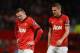 MANCHESTER, ENGLAND - FEBRUARY 09: Wayne Rooney of Manchester United looks on with Nemanja Vidic (R) during the Barclays Premier League match between Manchester United and Fulham at Old Trafford on February 9, 2014 in Manchester, England. (Photo by Mich