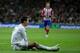 MADRID, SPAIN - FEBRUARY 05: Cristiano Ronaldo of Real Madrid CF lies on the ground after being tackled during the Copa del Rey semifinal first leg match between Real Madrid CF and Club Atletico Madrid at Estadio Santiago Bernabeu on February 5, 2014 in M