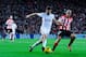 BILBAO, SPAIN - FEBRUARY 02: Xabi Alonso of Real Madrid CF clears the ball under pressure from Mikel Rico of Athletic Club during the La Liga match between Athletic Club and Real Madrid CF at San Mames Stadium on February 2, 2014 in Bilbao, Spain. (Phot
