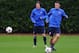 ST ALBANS, ENGLAND - OCTOBER 21: Mesut Oezil (R) and Tomas Rosicky of Arsenal in action during an Arsenal training session ahead of the UEFA Champions League Group F match against Borussia Dortmund at London Colney on October 21, 2013 in St Albans, Engla