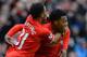 LIVERPOOL, ENGLAND - FEBRUARY 08: Daniel Sturridge of Liverpool celebrates scoring the fourth goal with team-mate Raheem Sterling during the Barclays Premier League match between Liverpool and Arsenal at Anfield on February 8, 2014 in Liverpool, England.