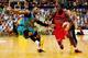TOWNSVILLE, AUSTRALIA - JANUARY 12: James Ennis of the Wildcats drives to the basket past Joshua Pace of the Crocodiles during the round 13 NBL match between the Townsville Crocodiles and the Perth Wildcats at Townsville Entertainment Centre in January 1
