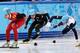 J.R. Celski (center) made a move, but failed to medal.