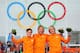 SOCHI, RUSSIA - FEBRUARY 10: (L-R) Silver medalist Jan Smeekens of the Netherlands, gold medallist Michel Mulder of the Netherlands and bronze medalist Ronald Mulder of the Netherlands celebrate on the podium during the flower ceremony for the Men's 500m