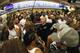A media-packed locker room in the NFL
