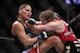 Oct 19, 2013; Houston, TX, USA; Sarah Kaufman (red gloves) fights against Jessica Eye (blue gloves) in their women's bantamweight bout during UFC 166 at Toyota Center. Mandatory Credit: Andrew Richardson-USA TODAY Sports