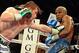 Sep 14, 2013; Las Vegas, NV, USA; Floyd Mayweather Jr. (blue gloves) and Canelo Alvarez battle it during their during their WBC and WBA super welterweight titles fight at MGM Grand Garden Arena. Mandatory Credit: Jayne Kamin-Oncea-USA TODAY Sports