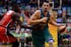 TOWNSVILLE, AUSTRALIA - FEBRUARY 07: Russell Hinder of the Crocodiles drives past James Ennis of the Wildcats during the round 17 NBL match between the Townsville Crocodiles and the Perth Wildcats at Townsville Entertainment Centre in February 7, 2014 i