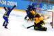 SOCHI, RUSSIA - FEBRUARY 11: Cecilia Osterberg #11 of Sweden celebrates scoring the second goal against Jennifer Harss #30 of Germany in the third period during the Women's Ice Hockey Preliminary Round Group B game on day four of the Sochi 2014 Winter Ol