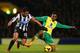 NORWICH, ENGLAND - JANUARY 28: Hatem Ben Arfa of Newcastle United and Leroy Fer of Norwich City battle for the ball during the Barclays Premier League match between Norwich City and Newcastle United at Carrow Road on January 28, 2014 in Norwich, England.