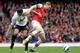 LONDON, ENGLAND - APRIL 28: Per Mertesacker of Arsenal and Robin van Persie of Manchester United battle for the ball during the Barclays Premier League match between Arsenal and Manchester United at Emirates Stadium on April 28, 2013 in London, England.