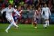 MADRID, SPAIN - FEBRUARY 11: Cristiano Ronaldo of Real Madrid CF scores their opening goal from a penalty shot during the Copa del Rey semi-final second leg match between Club Atletico de Madrid and Real Madrid CF at Vicente Calderon Stadium on February