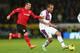 CARDIFF, WALES - FEBRUARY 11: Gary Medel (L) of Cardiff City tracks Gabriel Agbonlahor (R) of Aston Villa during the Barclays Premier League match between Cardiff City and Aston Villa at the Cardiff City Stadium on February 11, 2014 in Cardiff, Wales. (
