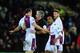 CARDIFF, WALES - FEBRUARY 11: Ron Vlaar of Villa and Fabian Delph (c) have words with referee Chris Foy during the Barclays Premier League match between Cardiff City and Aston Villa at Cardiff City Stadium on February 11, 2014 in Cardiff, Wales. (Photo