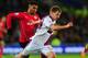 CARDIFF, WALES - FEBRUARY 11: Fraizer Campbell of Cardiff (l) challenges Marc Albrighton of Villa during the Barclays Premier League match between Cardiff City and Aston Villa at Cardiff City Stadium on February 11, 2014 in Cardiff, Wales. (Photo by St