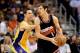 Mar 18, 2013; Phoenix, AZ, USA; Phoenix Suns guard Goran Dragic (1) handles the ball against Los Angeles Lakers guard Steve Nash (10) in the first half at US Airways Center. Mandatory Credit: Jennifer Stewart-USA TODAY Sports