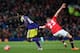 MANCHESTER, ENGLAND - JANUARY 05: Tom Cleverley of Manchester United grabs the shirt of Wilfried Bony of Swansea City during the FA Cup with Budweiser Third round match between Manchester United and Swansea City at Old Trafford on January 5, 2014 in Manc