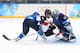 SOCHI, RUSSIA - FEBRUARY 12: Sara Benz #13 of Switzerland takes a shot on Noora Raty #41 of Finland during the Women's Ice Hockey Preliminary Round Group A game on day five of the Sochi 2014 Winter Olympics at Shayba Arena on February 12, 2014 in Sochi,