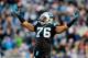 CHARLOTTE, NC - DECEMBER 15: Greg Hardy #76 of the Carolina Panthers tells the fans to cheer against the New York Jets during play at Bank of America Stadium on December 15, 2013 in Charlotte, North Carolina. (Photo by Grant Halverson/Getty Images)