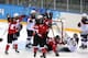 SOCHI, RUSSIA - FEBRUARY 12: Hayley Wickenheiser #22 of Canada celebrates with teammates after scoring a goal in the third period against Jessie Vetter #31 the United States during the Women's Ice Hockey Preliminary Round Group A game on day five of the