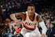 PORTLAND, OR - FEBRUARY 11: Damian Lillard #0 of The Portland Trail Blazers drives to the basket against the Oklahoma City Thunder on February 11, 2014 at the Moda Center in Portland, Oregon. NOTE TO USER: User expressly acknowledges and agrees that, by d