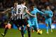 NEWCASTLE UPON TYNE, ENGLAND - FEBRUARY 12: Paulinho of Tottenham Hotspur goes past Michael Williamson of Newcastle United during the Barclays Premier League match between Newcastle United and Tottenham Hotspur at St James' Park on February 12, 2014 in