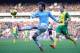 NORWICH, ENGLAND - FEBRUARY 08: David Silva of Manchester City crosses the ball during the Barclays Premier League match between Norwich City and Manchester City at Carrow Road on February 8, 2014 in Norwich, England. (Photo by Tony Marshall/Getty Imag