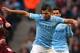 MANCHESTER, ENGLAND - JANUARY 25: Sergio Aguero of Manchester City holds off a challenge from Sean Murray of Watford during the FA Cup Fourth Round match sponsored by Budweiser between Manchester City and Watford at Etihad Stadium on January 25, 2014 in