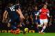 LONDON, ENGLAND - FEBRUARY 12: Mesut Ozil of Arsenal runs at the Manchester United defence during the Barclays Premier League match between Arsenal and Manchester United at the Emirates Stadium on February 12, 2014 in London, England. (Photo by Michael