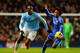 MANCHESTER, ENGLAND - FEBRUARY 03: Willian of Chelsea marshalls Yaya Toure of Manchester City during the Barclays Premier League match between Manchester City and Chelsea at Etihad Stadium on February 3, 2014 in Manchester, England. (Photo by Shaun Bott
