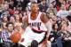 PORTLAND, OR - FEBRUARY 11: Damian Lillard #0 of the Portland Trail Blazers drives to the basket against the Oklahoma City Thunder on February 11, 2014 at the Moda Center Arena in Portland, Oregon. NOTE TO USER: User expressly acknowledges and agrees that
