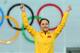 SOCHI, RUSSIA - FEBRUARY 13: Gold medalist Hong Zhang of China celebrates on the podium during the flower ceremony for the Speed Skating Women's 1000m event on day 6 of the Sochi 2014 Winter Olympics at Adler Arena Skating Center on February 13, 2014 in
