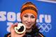 SOCHI, RUSSIA - FEBRUARY 12: Bronze medalist Margot Boer of the Netherlands celebrates during the medal ceremony for the Women's 500m on day five of the Sochi 2014 Winter Olympics at Medals Plaza on February 12, 2014 in Sochi, Russia. (Photo by Robert C