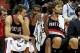 Dec 18, 2013; Minneapolis, MN, USA; Portland Trail Blazers center Joel Freeland (19), forward LaMarcus Aldridge (12) and center Robin Lopez (42) react on the bench during the fourth quarter against the Minnesota Timberwolves at Target Center. The Timberwo
