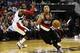 Feb 3, 2014; Washington, DC, USA; Portland Trail Blazers point guard Damian Lillard (0) dribbles the ball past Washington Wizards point guard John Wall (2) in the fourth quarter at Verizon Center. The Wizards won 100-90. Mandatory Credit: Geoff Burke-USA