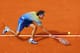 PARIS - MAY 25: Gustavo Kuerten of Brazil stretches for the ball during the Men's Singles first round match against Paul-Henri Mathieu of France on day one of the French Open at Roland Garros on May 25, 2008 in Paris, France. The French Open with be Kuer