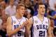 INDIANAPOLIS - APRIL 05: Mason Plumlee #5 and Miles Plumlee #21 of the Duke Blue Devils support their teammates from the bench against the Butler Bulldogs during the 2010 NCAA Division I Men's Basketball National Championship game at Lucas Oil Stadium on