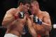 Oct 19, 2013; Houston, TX, USA; Gilbert Melendez (red gloves) fights against Diego Sanchez (blue gloves) in their lightweight bout during UFC 166 at Toyota Center. Mandatory Credit: Andrew Richardson-USA TODAY Sports