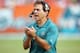 MIAMI - DECEMBER 10: Head coach Nick Saban of the Miami Dolphins claps for his defense after a key series of downs against the New England Patriots at Dolphin Stadium on December 10, 2006 in Miami, Florida. The Dolphins defeated the Patriots 21-0. (Photo
