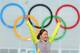 SOCHI, RUSSIA - FEBRUARY 11: Gold medalist Sang Hwa Lee of South Korea celebrates on the podium during the flower ceremony for the Speed Skating Women's 500m Event during day 4 of the Sochi 2014 Winter Olympics at Adler Arena Skating Center on February 1