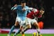 LONDON, ENGLAND - JANUARY 13: Jack Wilshere of Arsenal holds off Javi Garcia of Manchester City during the Barclays Premier League match between Arsenal and Manchester City at Emirates Stadium on January 13, 2013 in London, England. (Photo by Mike Hewit