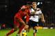 LONDON, ENGLAND - FEBRUARY 12: Raheem Sterling of Liverpool and Lewis Holtby of Fulham in action during the Barclays Premier League match between Fulham and Liverpool at Craven Cottage on February 12, 2014 in London, England. (Photo by Mike Hewitt/Getty