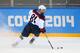 SOCHI, RUSSIA - FEBRUARY 13: Phil Kessel #81 of United States controls the puck against Slovakia during the Men's Ice Hockey Preliminary Round Group A game on day six of the Sochi 2014 Winter Olympics at Shayba Arena on February 13, 2014 in Sochi, Russia