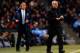 MANCHESTER, ENGLAND - FEBRUARY 03: Manuel Pellegrini manager of Manchester City and Jose Mourinho manager of Chelsea give instructions during the Barclays Premier League match between Manchester City and Chelsea at Etihad Stadium on February 3, 2014 in Ma