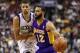 Feb 7, 2014; Philadelphia, PA, USA; Los Angeles Lakers guard Kendall Marshall (12) is defended by Philadelphia 76ers guard Michael Carter-Williams (1) during the fourth quarter at the Wells Fargo Center. The Lakers defeated the Sixers 112-98. Mandatory Cr