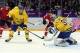 Feb 14, 2014; Sochi, RUSSIA; Sweden goalie Henrik Lundqvist (30) prepares to cover the puck against Switzerland in a men's preliminary round ice hockey game during the Sochi 2014 Olympic Winter Games at Bolshoy Ice Dome. Mandatory Credit: Winslow Townson-