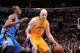 LOS ANGELES, CA - FEBRUARY 13: Chris Kaman #9 of the Los Angeles Lakers handles the ball against Serge Ibaka #9 of the Oklahoma City Thunder at Staples Center on February 13, 2014 in Los Angeles, California. NOTE TO USER: User expressly acknowledges and a