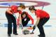 SOCHI, RUSSIA - FEBRUARY 14: Claire Hamilton and Vicki Adams of Great Britain sweep the ice as Eve Muirhead delivers the stone during the Curling Women's Round Robin match between Japan and Great Britain on day seven of the Sochi 2014 Winter Olympics at